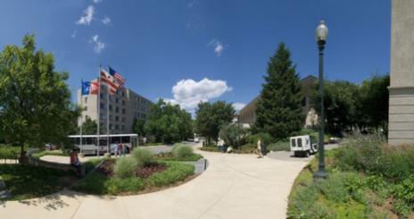 Shuttle driving through campus.